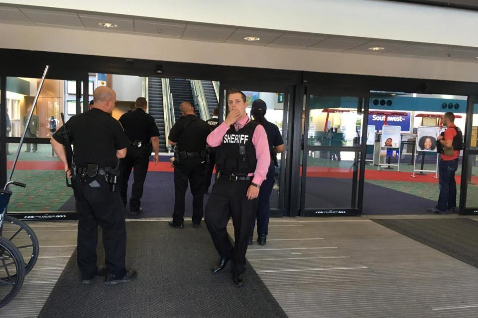 Police at the Flint airport following the stabbing (Dominic Adams/The Flint Journal-MLive.com via AP)