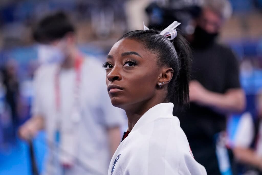 Simone Biles, of the United States, waits for her turn to perform during the artistic gymnastics women’s final at the 2020 Summer Olympics, Tuesday, July 27, 2021, in Tokyo. (AP Photo/Gregory Bull)