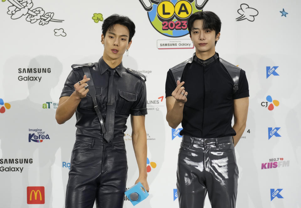 Shownu, left, and Hyungwon, of South Korean boy group Monsta X, attend KCON at the Los Angeles Convention Center on Friday, Aug. 18, 2023. (AP Photo/Chris Pizzello)