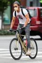 <p>Justin Theroux rides through N.Y.C. on Thursday wearing a grey beanie, a vintage tee and brown leather boots.</p>