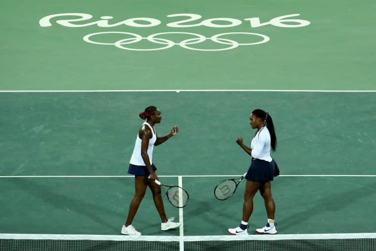 Venus and Serena Williams take the Olympic doubles court with style. (Photo: Getty Images)