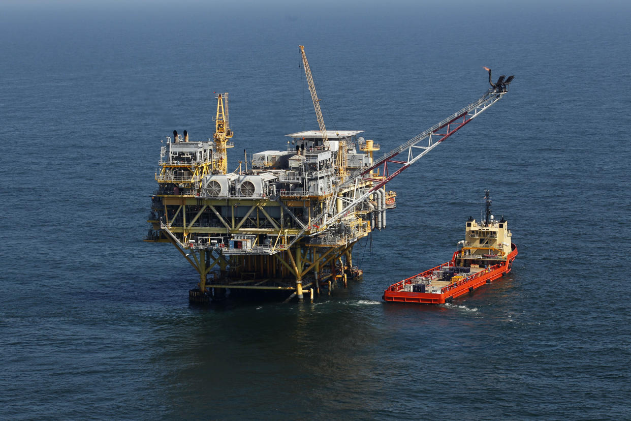 An oil rig and supply vessel in the Gulf of Mexico off the cost of Louisiana.