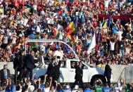 Pope Francis © greets pilgrims participating in the World Youth Day 2016 as he rides in his popemobile at the Campus Misericordiae in Brzegi, Poland, 30 July 2016, ahead of the evening vigil. (EPA/RADEK PIETRUSZKA POLAND OUT)