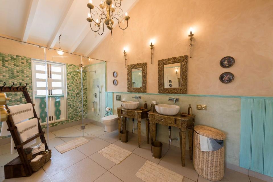 Its ensuite bathroom is lavish with His & Her shower cubicles and washbasins.