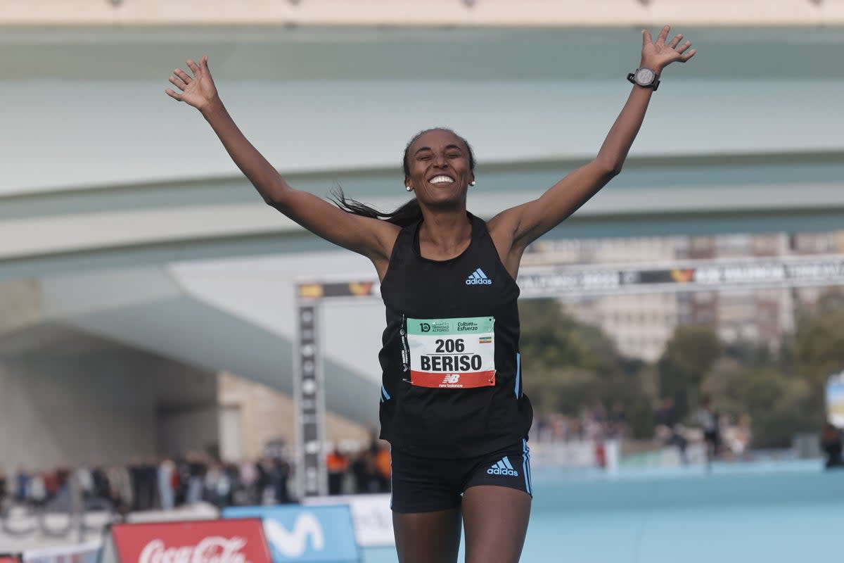 Ethiopian athlete Amane Beriso celebrates as she wins the women’s race at the Valencia Marathon (EPA)