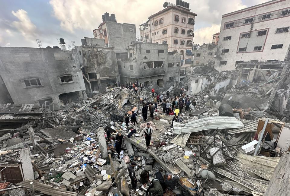 Residents and civil defense teams search for victims in the rubble of Israeli attacks on the Jabalia Camp in Gaza on Dec. 6, 2023.