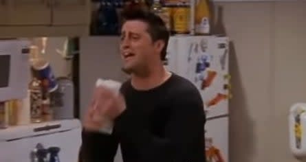 Joey holding his sandwich in "Friends"