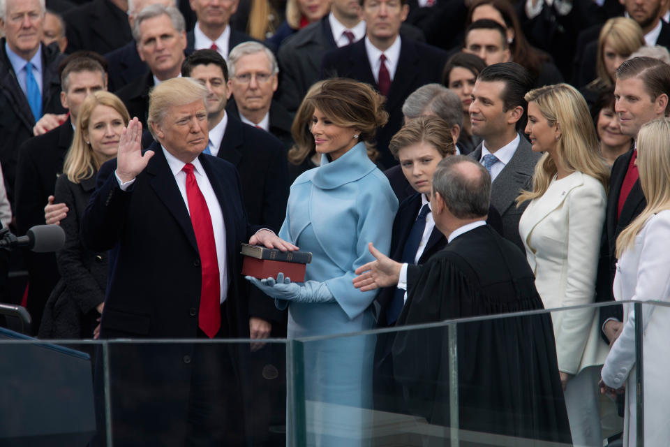 Chief Justice John Roberts administers the oath of office to Trump in 2017. (Christopher Morris)