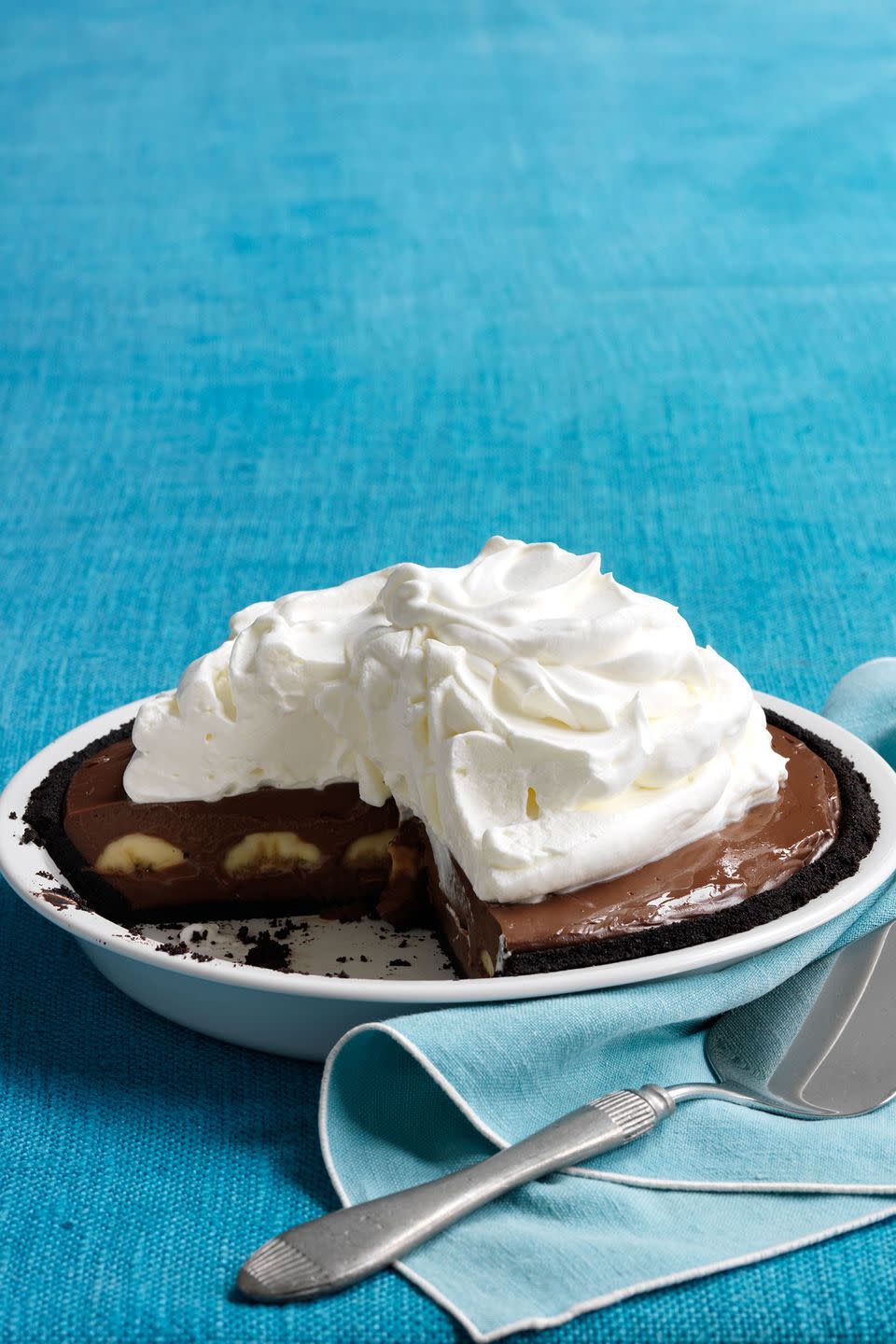 <p>Your Thanksgiving guests will be surprised and delighted when they bite into this rich pie and discover its chocolate wafer <a href="https://www.countryliving.com/food-drinks/g3845/thanksgiving-cookies/" rel="nofollow noopener" target="_blank" data-ylk="slk:cookie" class="link ">cookie</a> crust.</p><p><strong><a href="https://www.countryliving.com/food-drinks/recipes/a33398/double-chocolate-banana-cream-pie-recipe/" rel="nofollow noopener" target="_blank" data-ylk="slk:Get the recipe" class="link ">Get the recipe</a>.</strong> </p>
