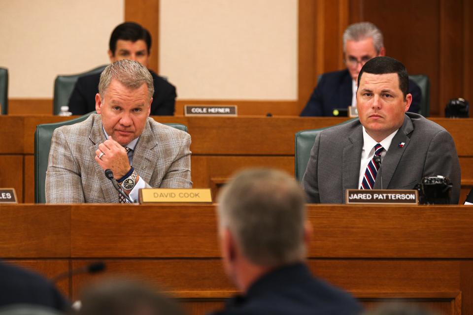 State Reps. David Cook, R-Mansfield, left, and Jared Patterson, R-Frisco, right, listen to testimony from members of the Texas Police Chiefs Association during a joint committee hearing Thursday about the Uvalde mass shooting.