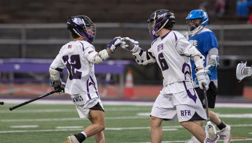 Rumson-Fair Haven's Philip Passalaqua (No. 6) celebrates with freshman Grayson Goldin (No. 32) after a first half goal with a teammate. Rumson-Fair Haven Boys Lacrosse defeat Shore Regional in Rumson on April 6, 2022.