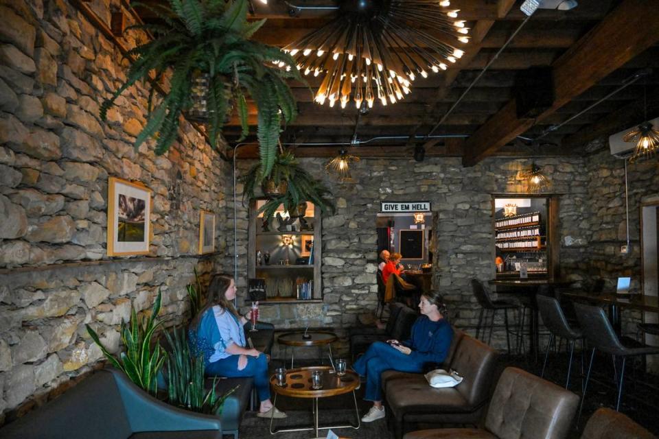 Drastic Measures is located in an 1,100-square-foot room in a Shawnee stone building that dates to the 1850s. Faryle Barthuly, left, of Lenexa, and Reilly Oliver of Westwood Hills met there for drinks over happy hour.