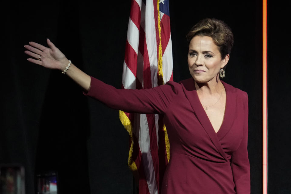 Kari Lake, Arizona Republican candidate for governor, waves to her supporters at the Republican watch party in Scottsdale, Ariz., Tuesday, Nov. 8, 2022. (AP Photo/Ross D. Franklin)