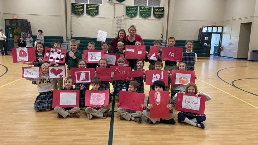 Will Carleton girls basketball coach Kennedy Chesney's class made signs and posters for Clemmie Gadwood's signing day.