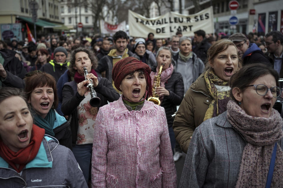 Protesters play music during a demonstration in Lyon, central France, Saturday, March 11, 2023. Opponents of President Emmanuel Macron's hotly contested plan to raise the retirement age from 62 to 64 were taking to the streets of France on Saturday for the second time this week in what union's hope will be a new show of force meant to push the government to back down. (AP Photo/Laurent Cipriani)