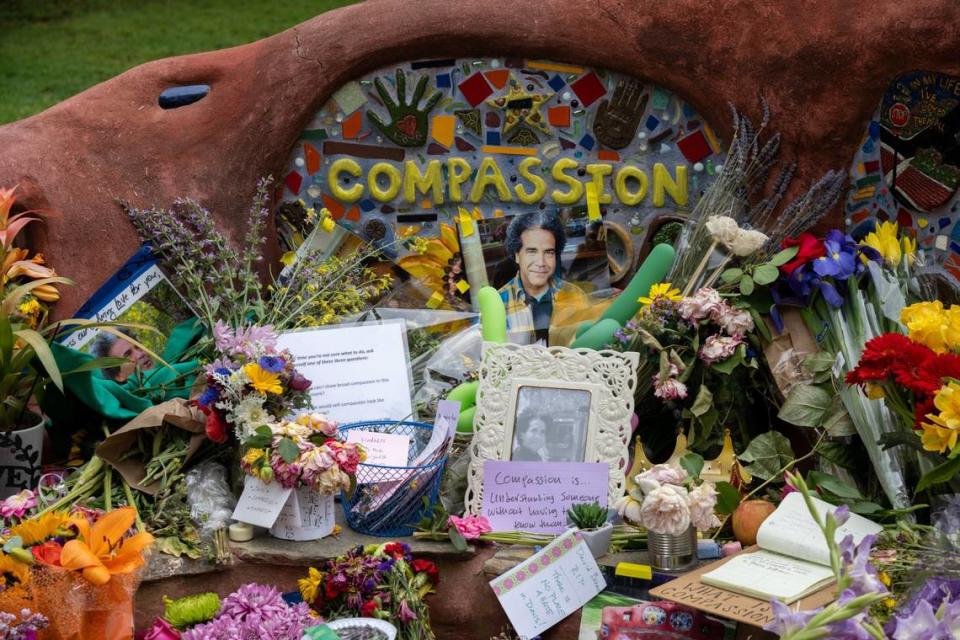 A memorial set up at the compassion bench in Davis on Monday, May 1, 2023, remembers David Henry Breaux, 50, who was found stabbed to death April 27, 2023 in Central Park.