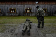 A commander instructs a recruit during a 16-day basic training for Poland's Territorial Defence Forces, at a shooting range near Siedlce, Poland, December 7, 2017. REUTERS/Kacper Pempel/Files