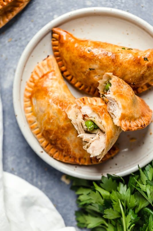 <p>Skinny Taste</p><p>These leftover turkey pot pie empanadas, or hand pies, are a delicious way to use up your leftover Thanksgiving turkey!</p><p><strong>Get the recipe: <a href="https://www.skinnytaste.com//leftover-turkey-pot-pie-empanadas/" rel="nofollow noopener" target="_blank" data-ylk="slk:Leftover Turkey Pot Pie Empanadas;elm:context_link;itc:0;sec:content-canvas" class="link rapid-noclick-resp">Leftover Turkey Pot Pie Empanadas</a></strong></p>