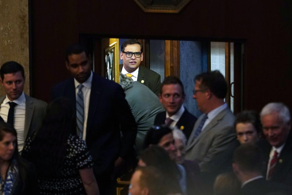 Rep. George Santos, R-N.Y., arrives at the House Chamber, Thursday, May 11, 2023, at the Capitol in Washington, as House Republicans are on track to pass a sweeping bill to build more U.S.-Mexico border wall and impose new restrictions on asylum seekers. (AP Photo/Jacquelyn Martin)