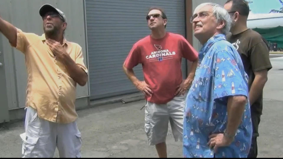 Dennis Davern, left, with investigators in Hawaii / Credit: CBS News