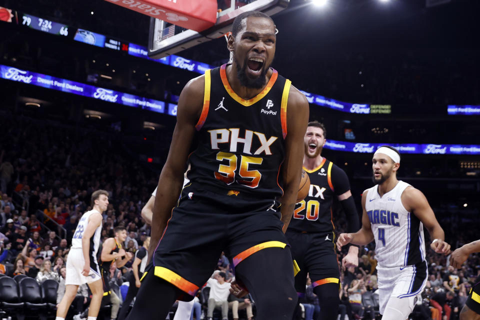 PHOENIX, ARIZONA - DECEMBER 31: Kevin Durant #35 of the Phoenix Suns reacts after dunking during the game against the Orlando Magic at Footprint Center on December 31, 2023 in Phoenix, Arizona. The Suns defeated the Magic 112-107. NOTE TO USER: User expressly acknowledges and agrees that, by downloading and or using this photograph, User is consenting to the terms and conditions of the Getty Images License Agreement.  (Photo by Chris Coduto/Getty Images)