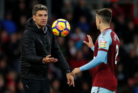 Soccer Football - Premier League - Southampton vs Burnley - St Mary's Stadium, Southampton, Britain - November 4, 2017 Southampton manager Mauricio Pellegrino throws the ball to Burnley's Matthew Lowton Action Images via Reuters/John Sibley