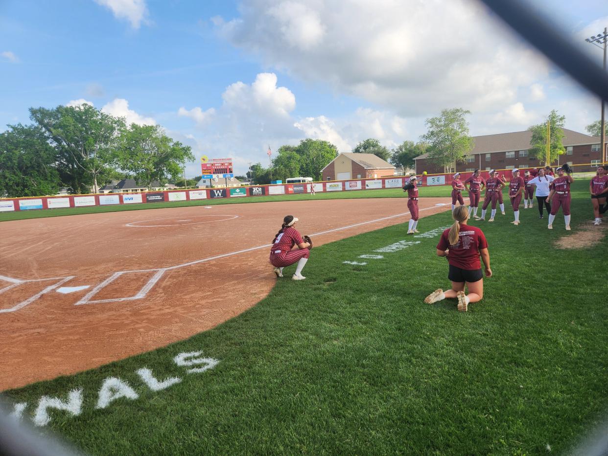 E.D. White softball team warms up before Thursday's LHSAA quarterfinal game against Haynes Academy.