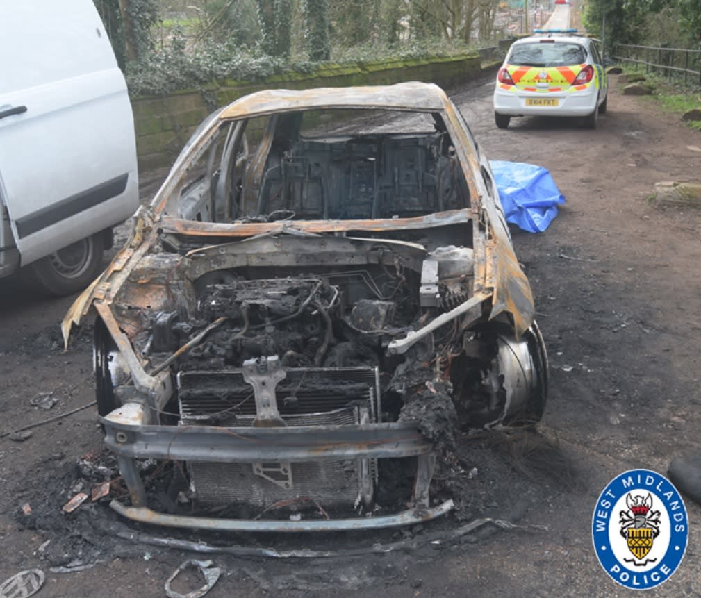 The burnt out car was found with bullet shells in the boot (West Midlands Police)