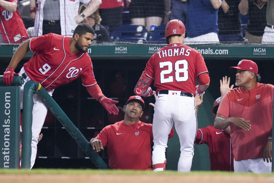 Washington Nationals' Lane Thomas returns to the dugout after his solo home run against the Arizona Diamondbacks during the fifth inning of a baseball game at Nationals Park, Tuesday, June 6, 2023, in Washington. (AP Photo/Alex Brandon)