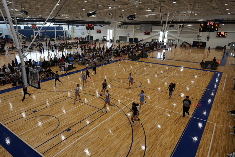 Girls basketball teams participate in the NCAA College Basketball Academy, Saturday, July 29, 2023, in Memphis, Tenn. The tournament brought together the top AAU teams from around the country to play for the U.S. Open championship. (AP Photo/George Walker IV)