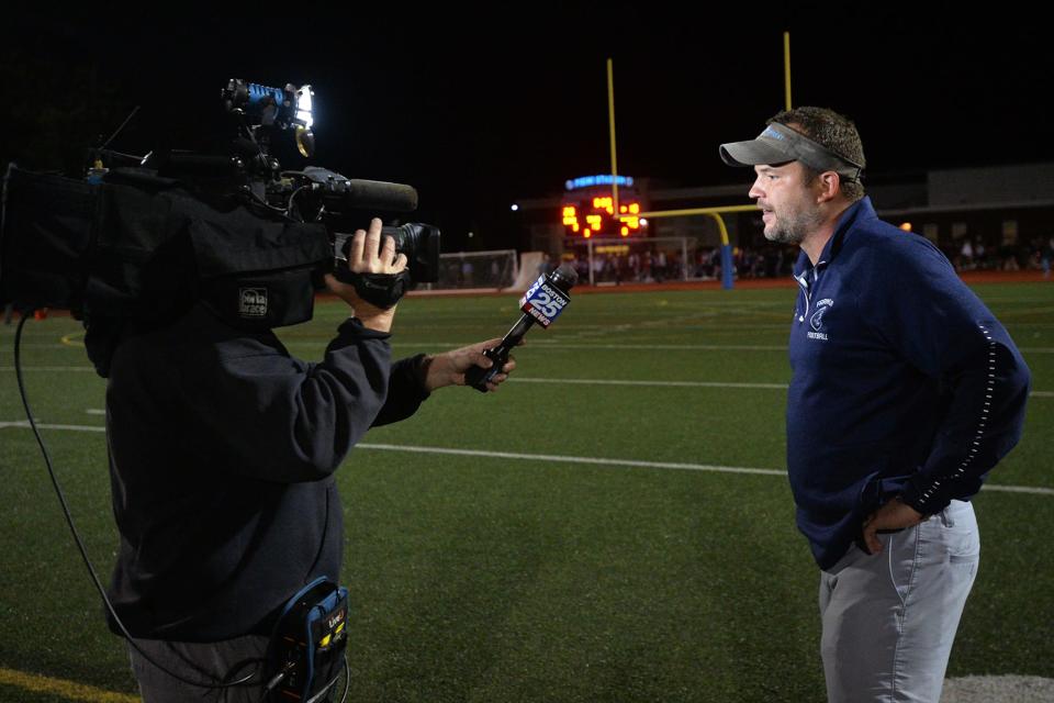 Franklin High School football head coach Eian Bain is interviewed after defeating Mansfield, 28-10, on Oct. 1, 2021.