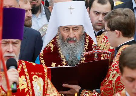 Metropolitan of Kiev and All Ukraine Onufry (Onufriy), the Primate of the Ukrainian Orthodox Church of the Moscow Patriarchate, conducts a memorial service at the Tomb of Unknown Soldier in Kiev, Ukraine May 9, 2018. Picture taken May 9, 2018. REUTERS/Valentyn Ogirenko