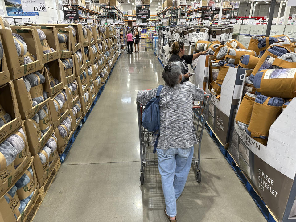 Shoppers look at blankets on sale in a Costco warehouse Thursday, Aug. 24, 2023, in Sheridan, Colo. On Wednesday, the Labor Department issues its consumer prices report for August. (AP Photo/David Zalubowski)