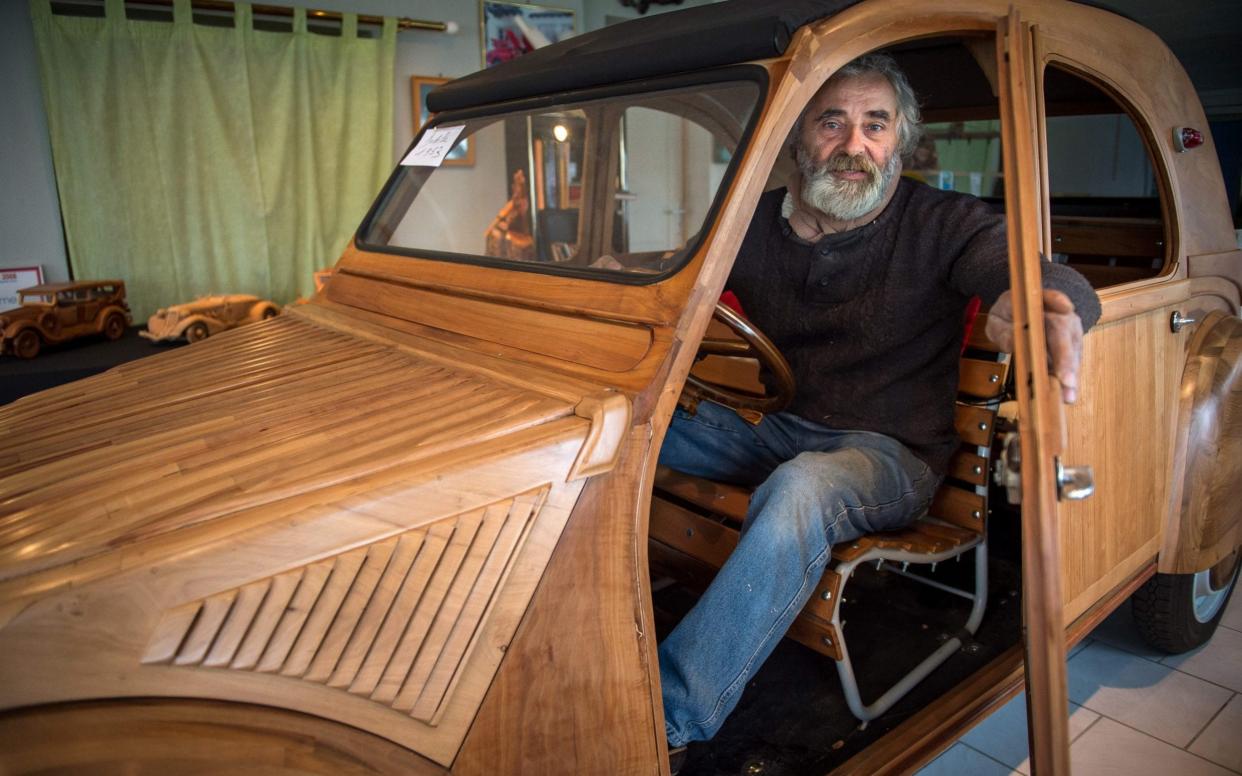 Michel Robillard with his wooden Citroën 2CV - AFP