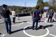 Supporters social distance in circles as they listen to Democratic vice presidential candidate Sen. Kamala Harris, D-Calif., at UNC-Asheville, Wednesday, Oct. 21, 2020, in Asheville, N.C. (AP Photo/Kathy Kmonicek)