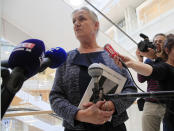 Doctor Irene Frachon, who discovered that the drug Mediator could have fatal side effect, speaks to reporters as she arrived at Paris courthouse Monday, Sept. 23, 2019. A massive trial with more than 4,000 plaintiffs is opening for French pharmaceutical giant Servier Laboratoires and France's medicines watchdog. (AP Photo/Michel Euler)