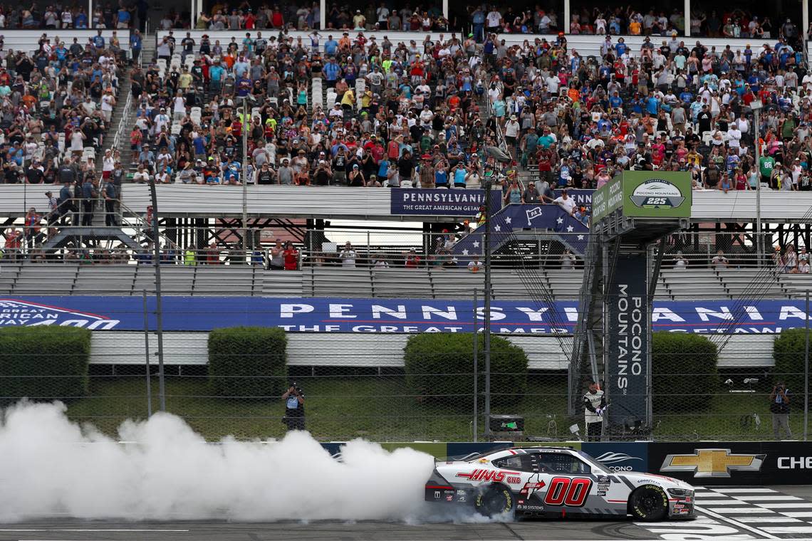 Jul 13, 2024; Long Pond, Pennsylvania, USA; NASCAR Xfinity Series driver Cole Custer (00) celebrates after winning the Explore The Pocono Mountains 225 at Pocono Raceway.