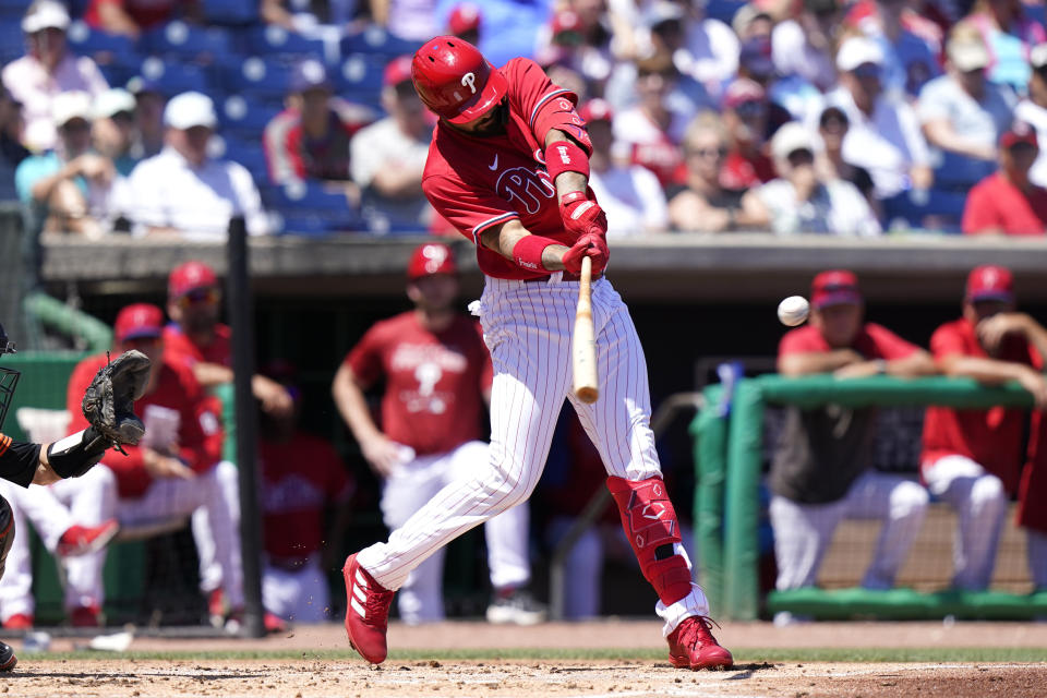 Philadelphia Phillies' Nick Castellanos hits a a two run home run during the first inning of a spring training baseball game against the Baltimore Orioles, Monday, March 28, 2022, in Clearwater, Fla. (AP Photo/Lynne Sladky)