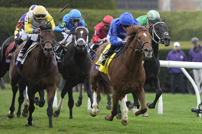 William Buick rides Modern Games (4) to victory during the Breeders' Cup Mile race at the Keenelend Race Course, Saturday, Nov. 5, 2022, in Lexington, Ky. (AP Photo/Darron Cummings)