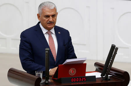 Turkey's new Prime Minister Binali Yildirim reads his government's programme at the Turkish parliament in Ankara, Turkey, May 24, 2016. REUTERS/Umit Bektas