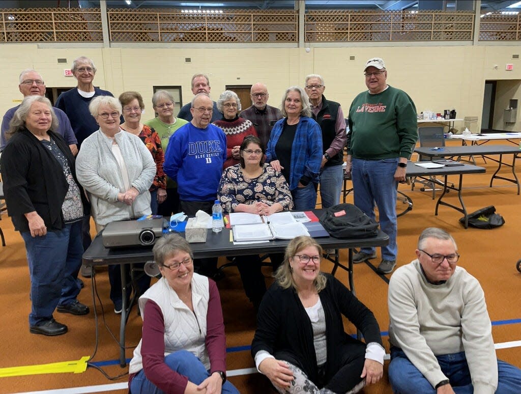 Volunteers, back from left, Floyd Zornes, Larry Goss, Marcia Schmidt, Jackie Riley, Roy Sutfin, Glenda Lewis, Jack Lewis, Charles Foley, middle from left, Yutonia Scowden, Norma Griffith, Joe Reznik, Diane Marine, Sue Cameron, Chuck Gartner, front from left, Jackie Wright, Les Johnson, Chip Cates, attend the 2022 training for VITA/TCE tax preparers at WestArk RSVP.