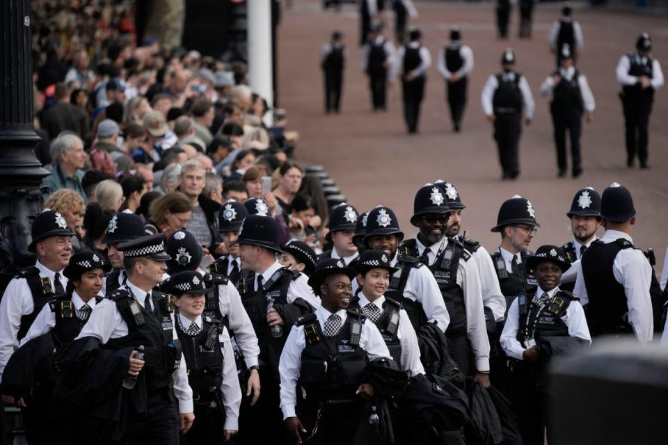 Police officers gathered on The Mall ahead of the process on Wednesday, 15 September (PA)