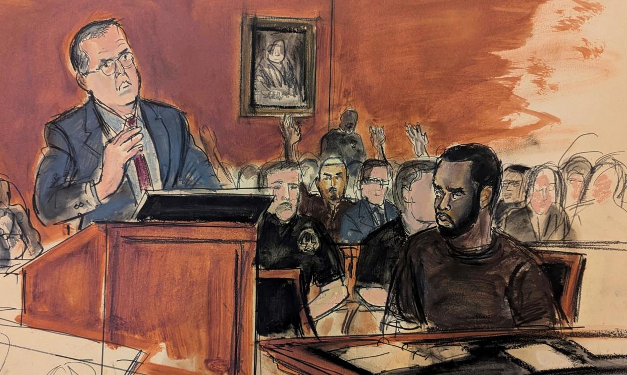 <span>A courtroom sketch of Sean Combs looking at attorney Marc Agnifilo, left, in federal court in New York City.</span><span>Photograph: Elizabeth Williams/AP</span>