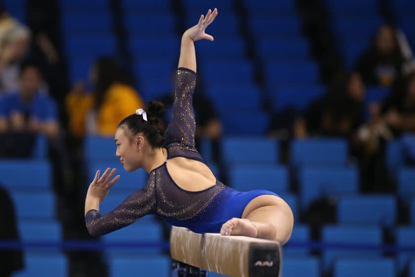 LOS ANGELES, CALIFORNIA - MARCH 30: Emily Lee of the UCLA Bruins competes on balance beam.