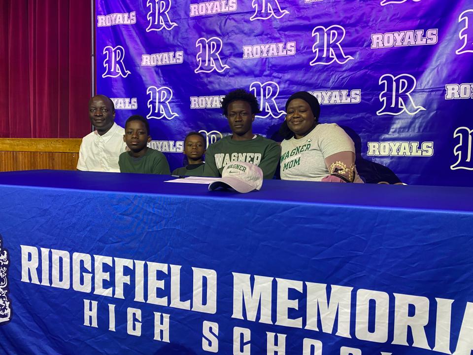 Ridgefield HS senior Lasana Darboe, second from right, signed his letter of intent for Wagner to run track. He is joined by Janding Jawana, Mohammed Fatti, Baba Fatti and Emran Saidy.