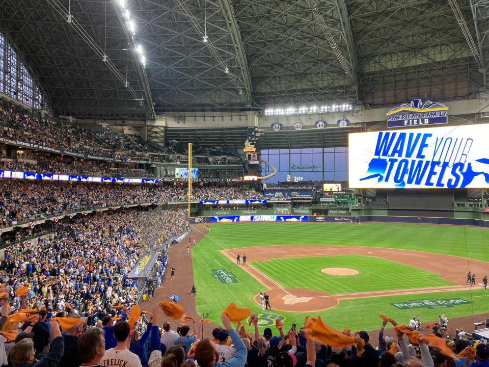 Fans wave their rally towels before the start of Game 2 in the National League wild card series between the host Milwaukee Brewers and New York Mets on Oct. 2, 2024.