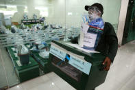 Bangkok district officers prepare ballot boxes and other documents ahead of the general election at a local district office in Bangkok, Thailand, March 23, 2019. REUTERS/Athit Perawongmetha