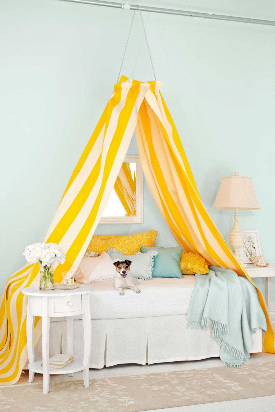 <p>This easy project makes smart use of an embroidery hoop and a pair of ready-made curtains.</p><p><a rel="nofollow noopener" href="http://www.countryliving.com/diy-crafts/how-to/a2870/diy-canopy-bed-0709/" target="_blank" data-ylk="slk:Get the tutorial;elm:context_link;itc:0;sec:content-canvas" class="link ">Get the tutorial</a>. </p>