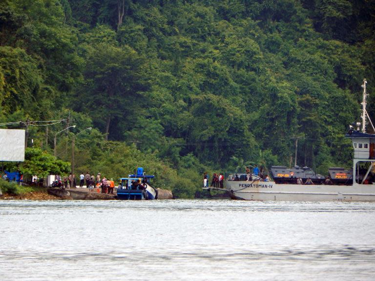 A boat delivers Indonesian police armored vehicles carrying Australians on death row Andrew Chan and Myuran Sukumaran to a maximum security prison on Nusa Kambangan island, in Cilacap, central Java on March 4, 2015