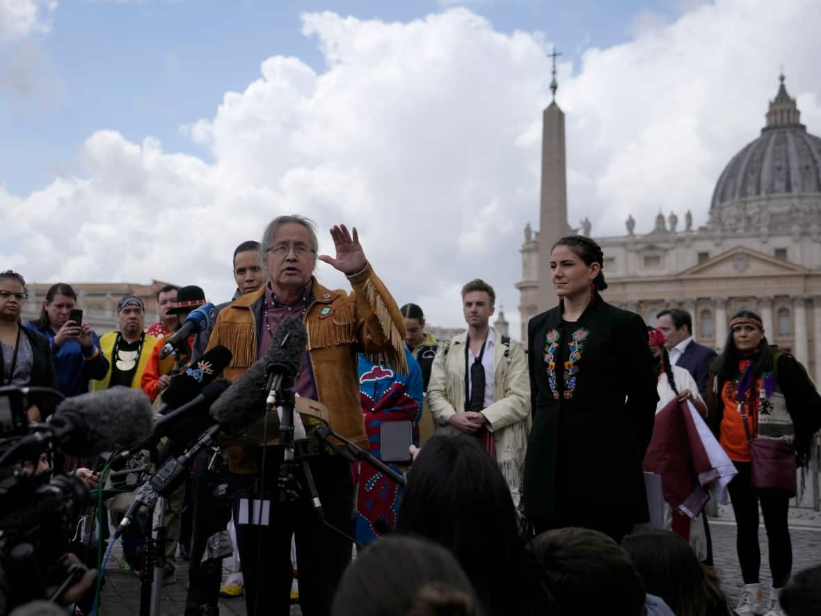 Gerald Antoine, centre, First Nations NWT Regional Chief, is flanked by Natan Obed, president of Inuit Tapiriit Kanatami delegation, left, and Cassidy Caron, President of the Metis community, as they meet reporters in St. Peter's Square at the Vatican, after their meeting with Pope Francis, Friday, April 1, 2022 (AP Photo/Alessandra Tarantino - image credit)